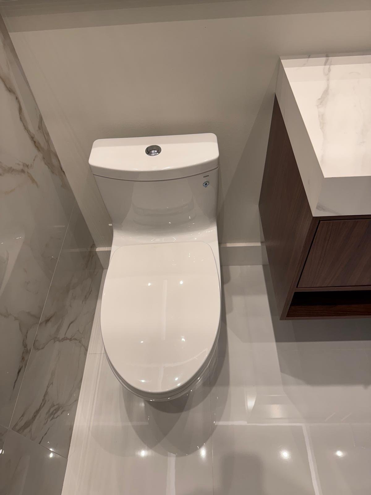 Polished porcelain bathroom floor with a floating vanity